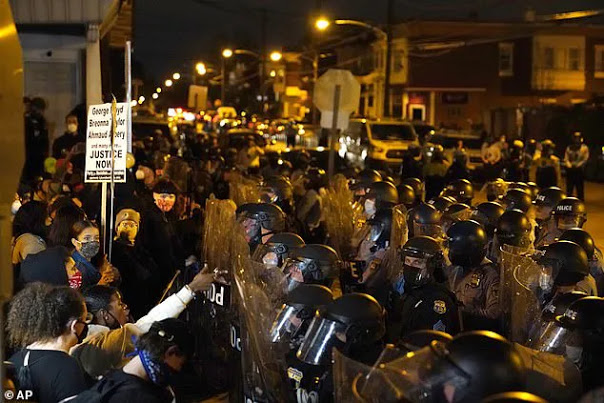 Protesters confront police during a march Tuesday in Philadelphia.