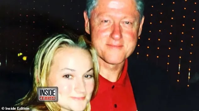 Clinton with his arm round Chauntae Davies